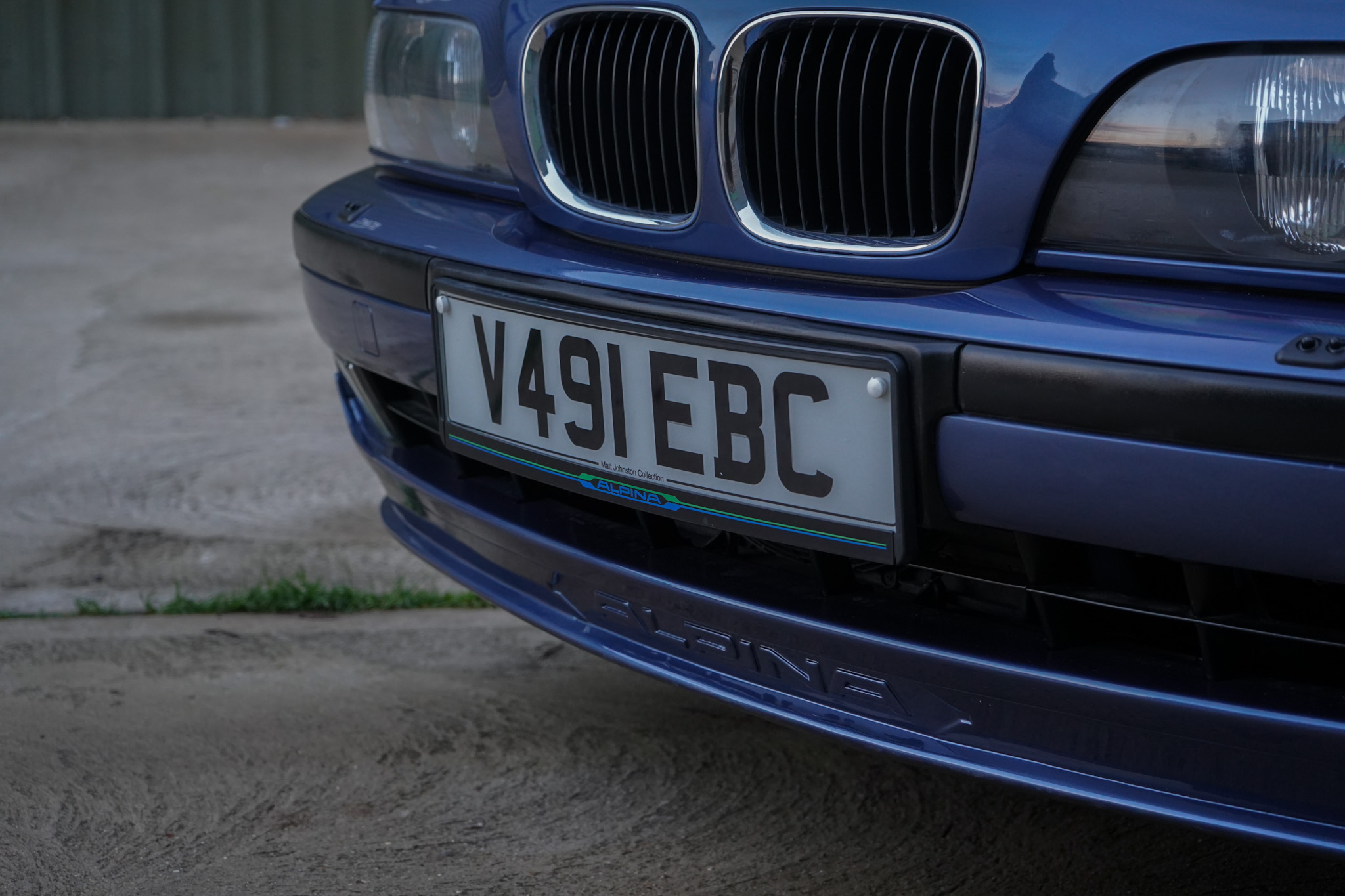 Blue 1999 BMW E39 Alpina B10 3.3 Manual showing the front grille and alpina bumper detail.