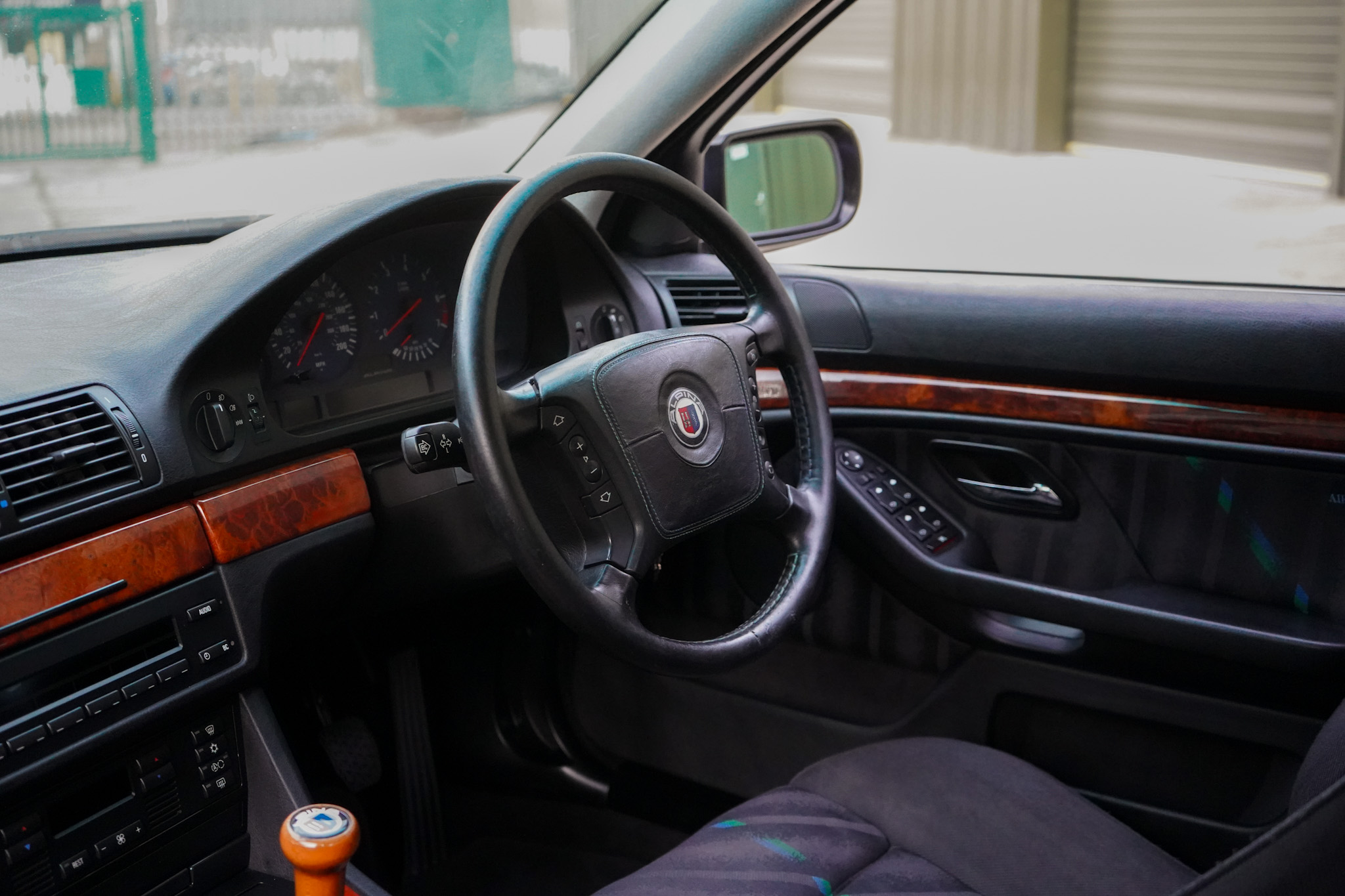 1999 BMW E39 Alpina B10 3.3 Manual interior showing the steering wheel and dashboard.