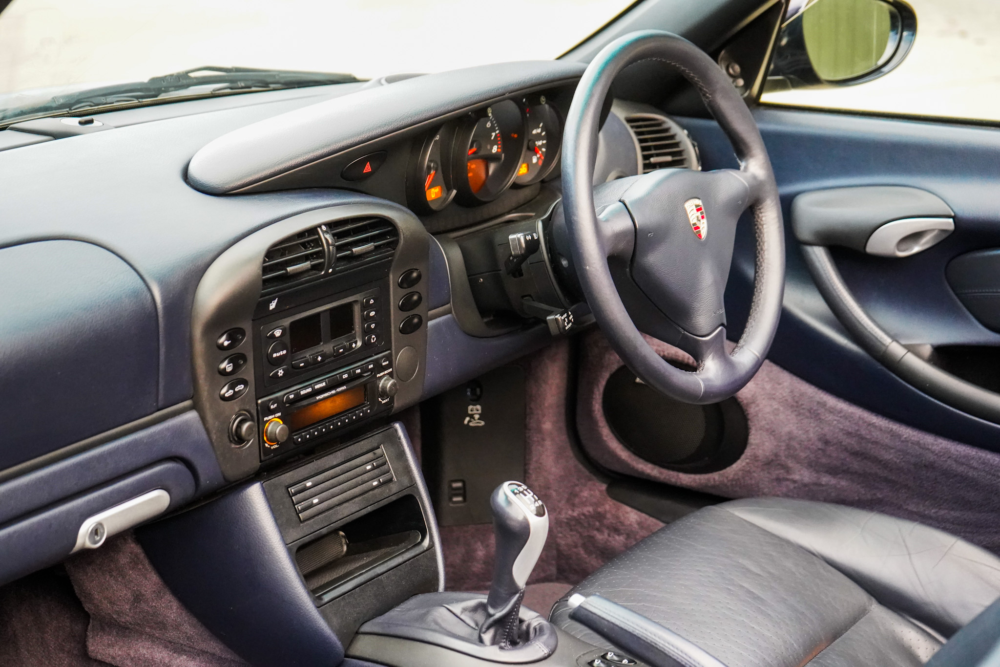 2003 Porsche Boxster (986) interior showing the centre console and dashboard.