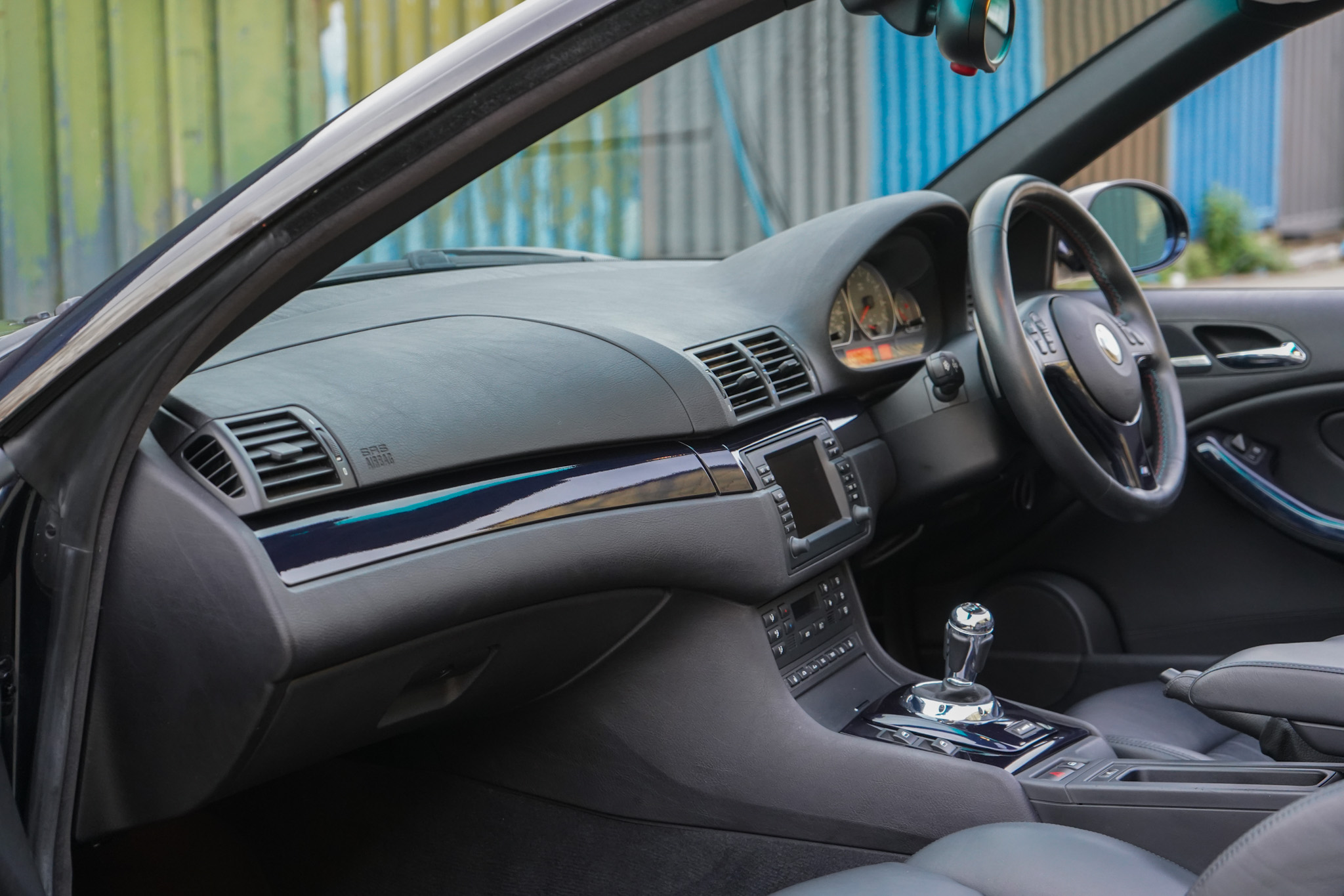 2003 BMW M3 (E46) Convertible interior showing the dashboard and cockpit.