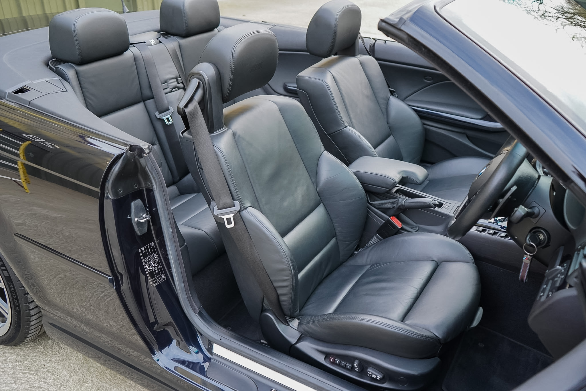 2003 BMW M3 (E46) Convertible interior showing the high-angle front seats and cabin.