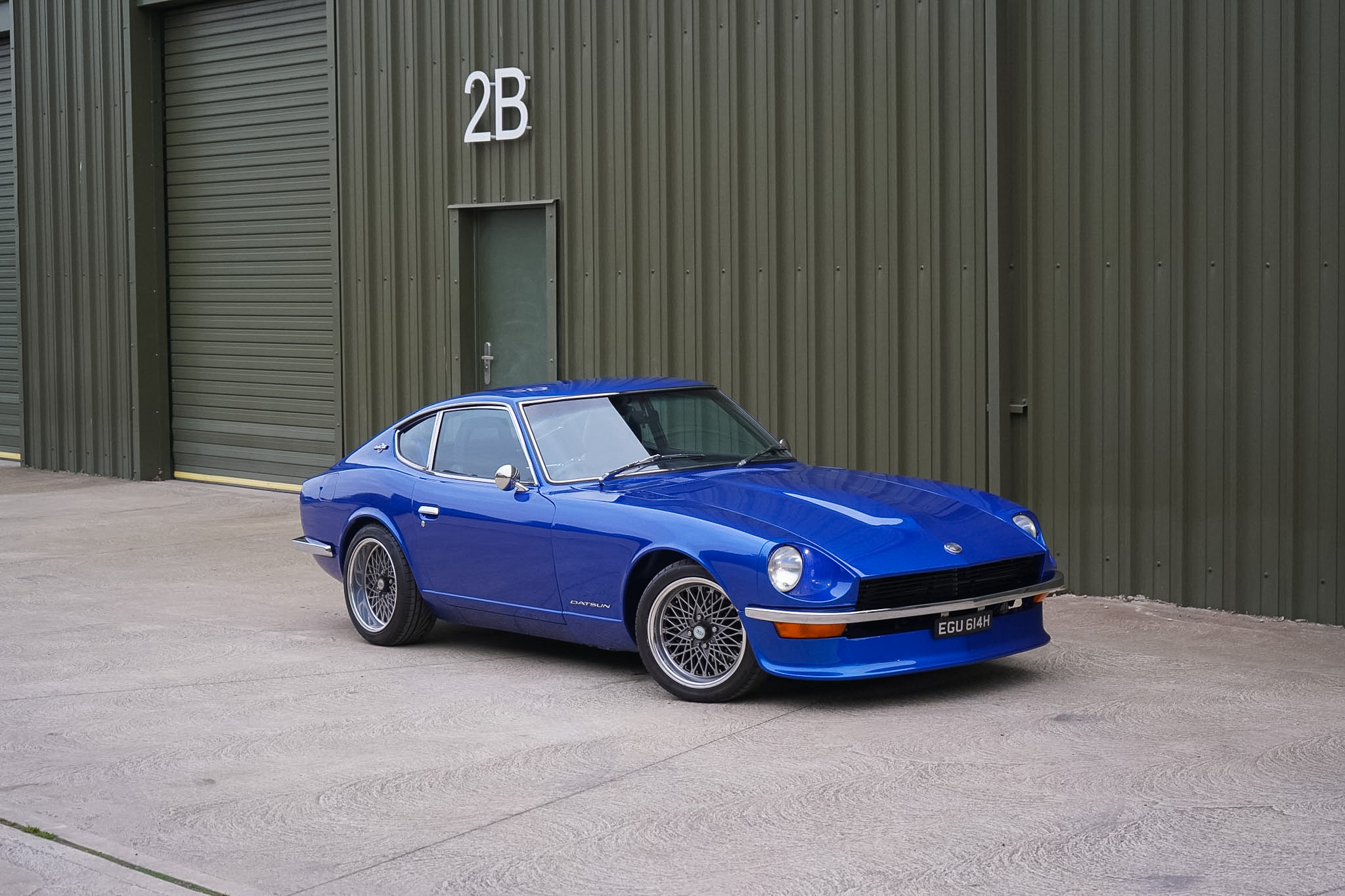 Blue Datsun 240Z Restomod alternate front three-quarter view.