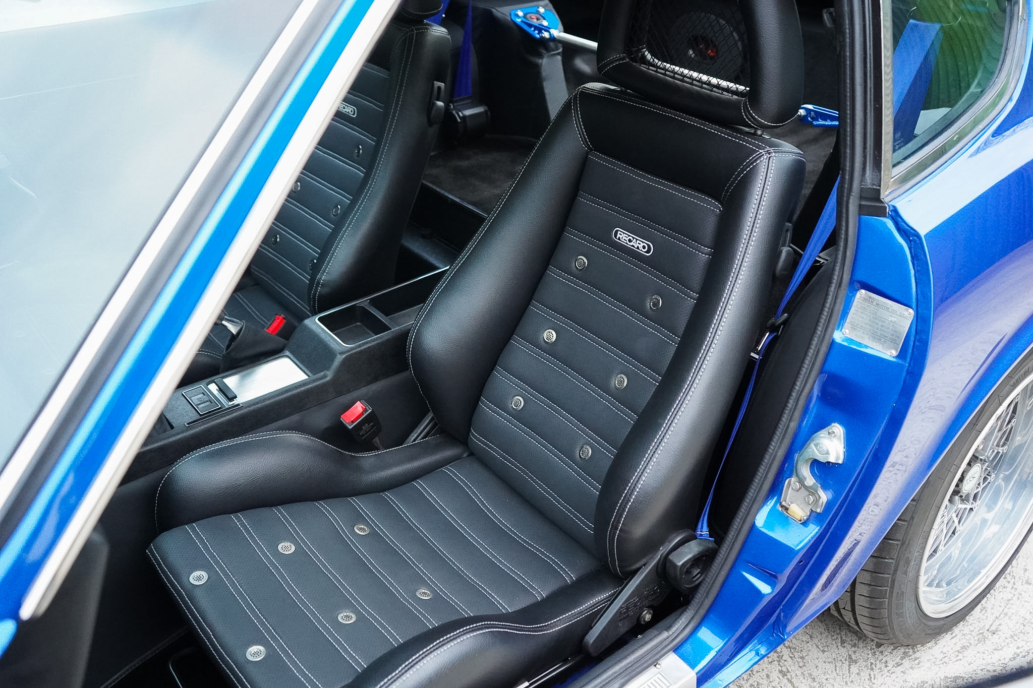 Datsun 240Z Restomod front seats viewed through the open door.
