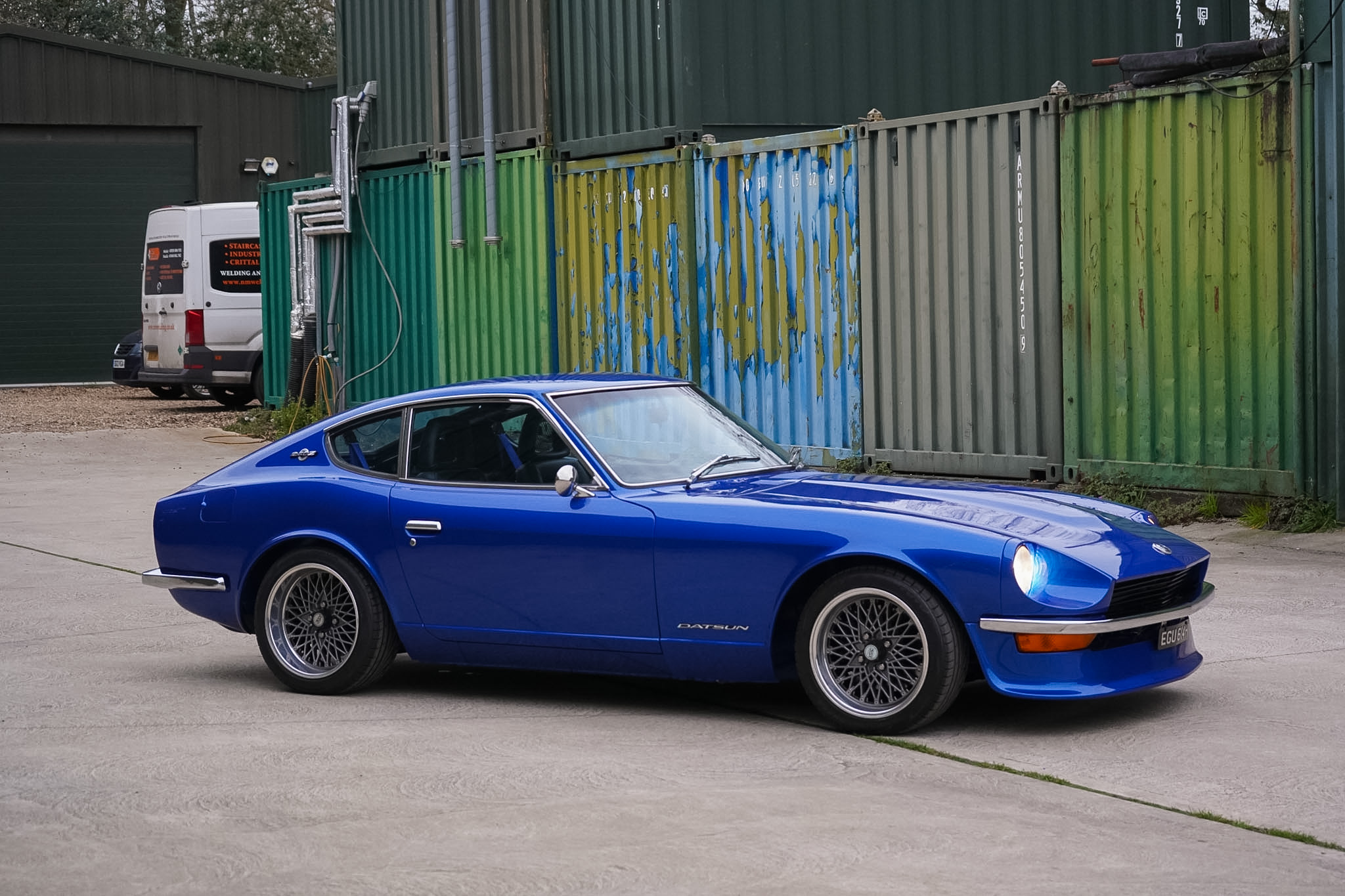 Blue Datsun 240Z Restomod side view with front three-quarter angle.