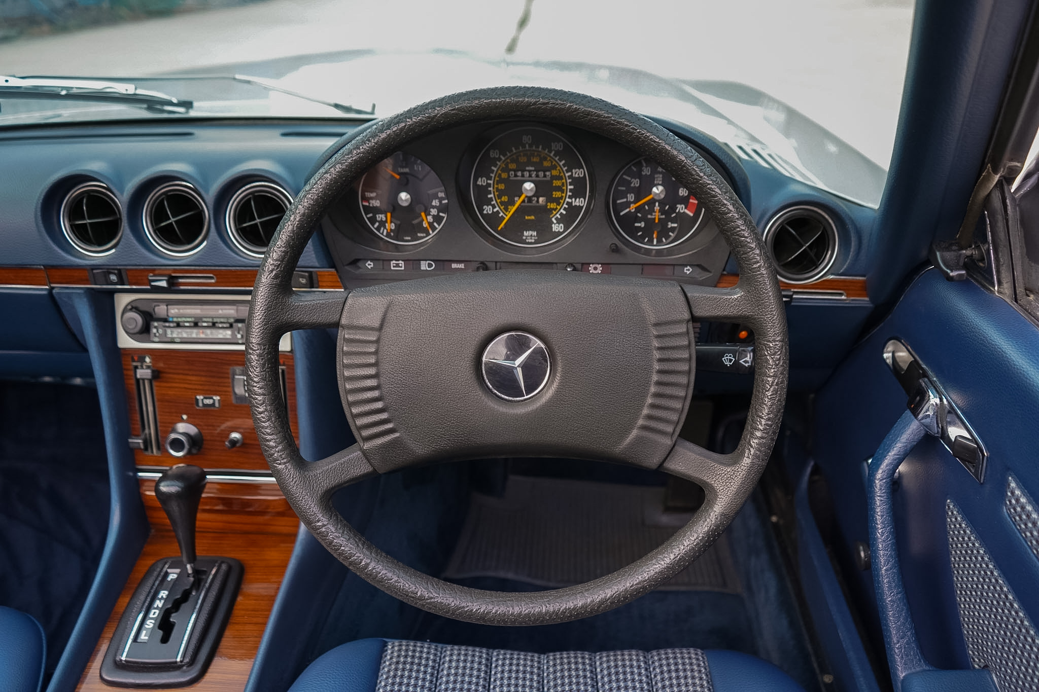 Mercedes-Benz 350 SL (R107) steering wheel and instrument-cluster view.