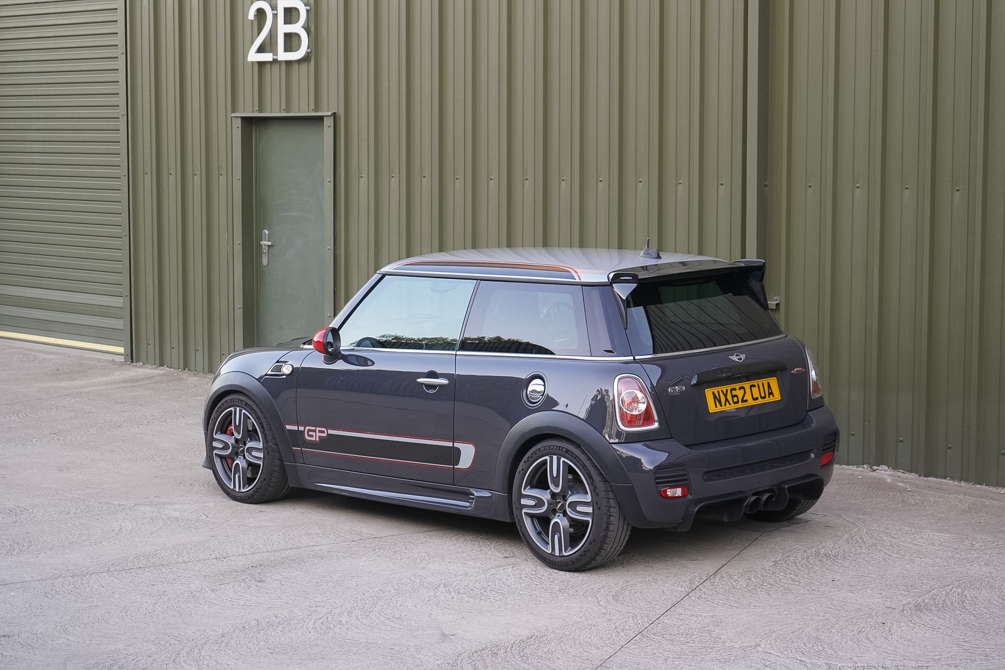 Dark grey MINI GP2 (R56) rear three-quarter view.